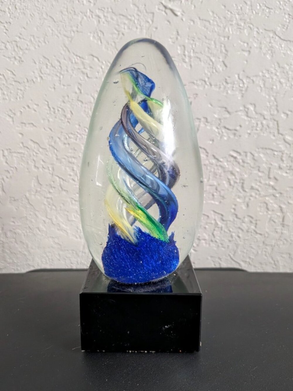 Art Glass Egg Paperweight Clear Blue Green Yellow Swirl w/ Black Base Glossy